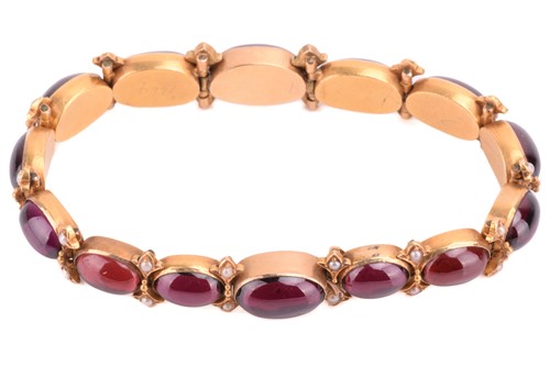 Lot 212 - A Victorian garnet and seed pearl bracelet,...