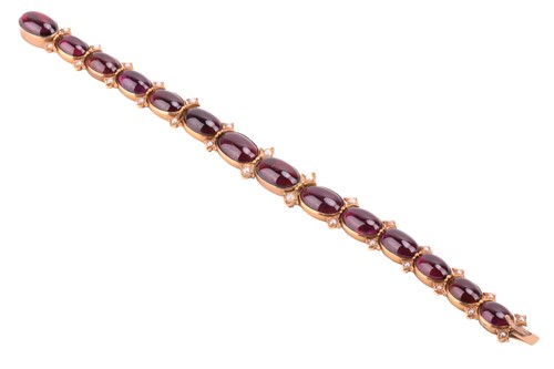 Lot 212 - A Victorian garnet and seed pearl bracelet,...