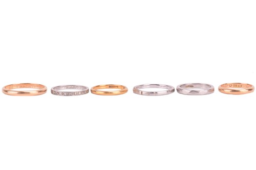 Lot 135 - Five wedding bands and an eternity ring; to...