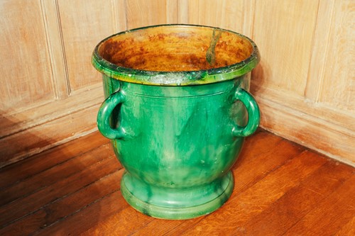 Lot 23 - A modern green glazed ceramic planter, with...