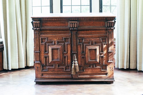Lot 37 - A late 17th-century oak cabinet, the pair of...
