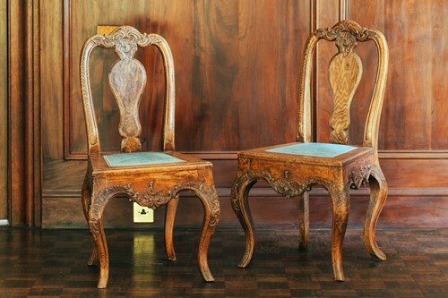 Lot 50 - A pair of 18th century oak carved chairs,...