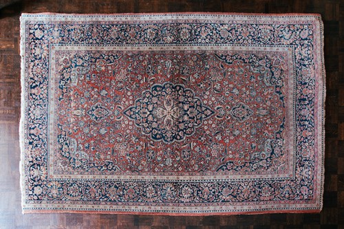 Lot 54 - A Kashan rug with central medalion within...