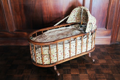Lot 57 - An oak spindle frame child's cot, 19th century,...