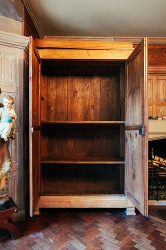 Lot 65 - A 19th century Continental maple armoire, the...