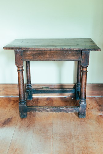 Lot 135 - An 18th century oak side table, on turned...