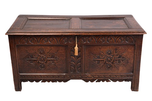 Lot 139 - An early 18th-century oak coffer, hinged panel...