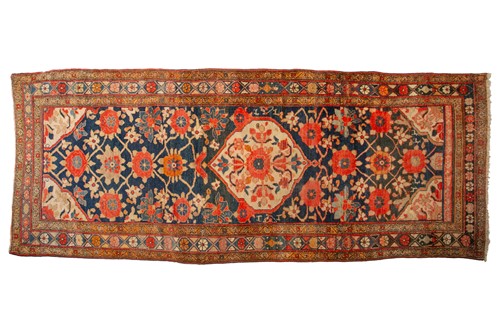 Lot 162 - An antique large Mahal runner with dark blue...