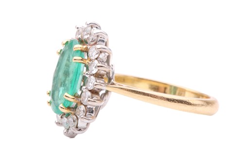 Lot 51 - An emerald and diamond cluster ring, the oval...