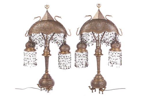 Lot 282 - A pair of brass Moroccan table lamps, with...