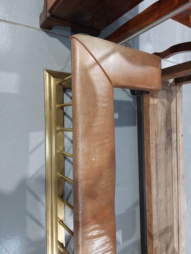 Lot 197 - A brass club fender, with leather covered seat...
