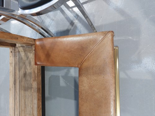 Lot 197 - A brass club fender, with leather covered seat...