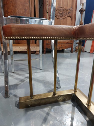 Lot 197 - A brass club fender, with leather covered seat...