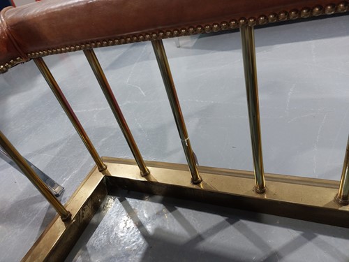 Lot 197 - A brass club fender, with leather covered seat...