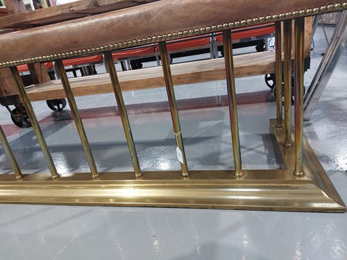 Lot 197 - A brass club fender, with leather covered seat...
