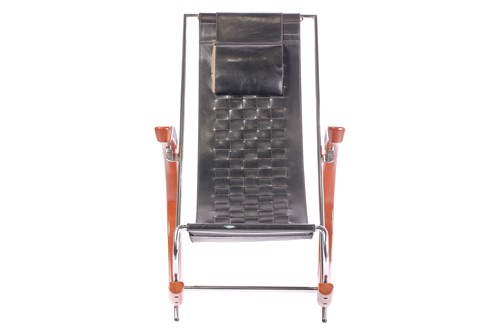 Lot 290 - A black leather 'Donna' Rocking chair by Elio...