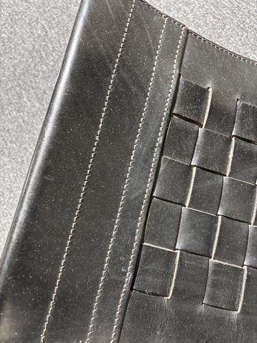 Lot 290 - A black leather 'Donna' Rocking chair by Elio...