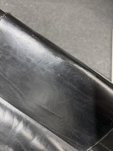 Lot 290 - A black leather 'Donna' Rocking chair by Elio...