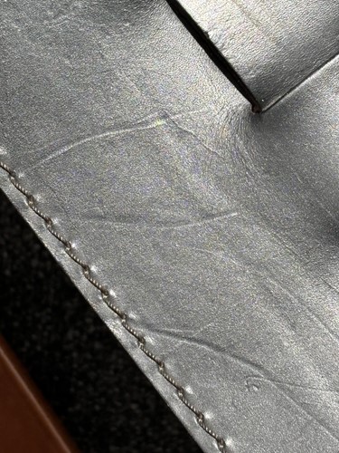 Lot 290 - A black leather 'Donna' Rocking chair by Elio...