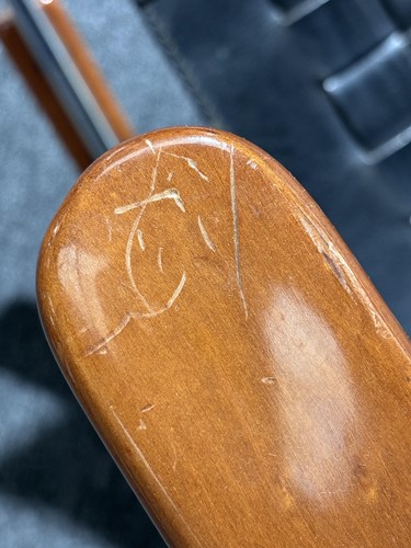 Lot 290 - A black leather 'Donna' Rocking chair by Elio...