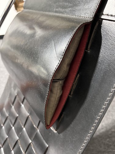 Lot 290 - A black leather 'Donna' Rocking chair by Elio...