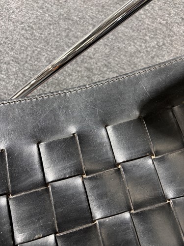 Lot 290 - A black leather 'Donna' Rocking chair by Elio...