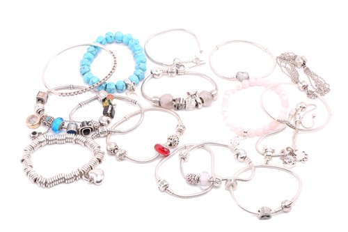 Lot 40 - An aggregate of branded bracelets in white...
