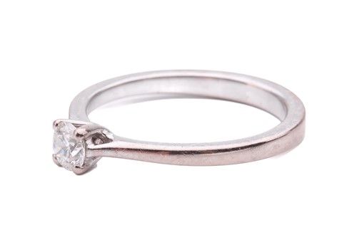 Lot 35 - A diamond solitaire ring, set with a round...