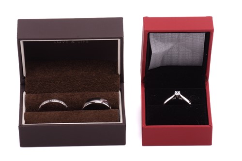 Lot 159 - Three platinum rings; including a diamond...