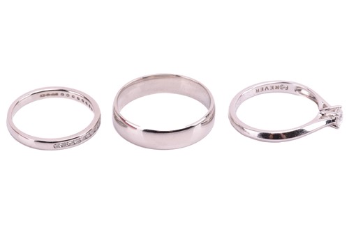 Lot 159 - Three platinum rings; including a diamond...
