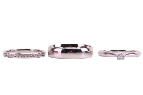 Lot 159 - Three platinum rings; including a diamond...