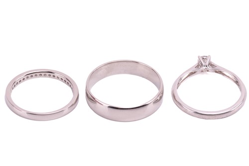 Lot 159 - Three platinum rings; including a diamond...