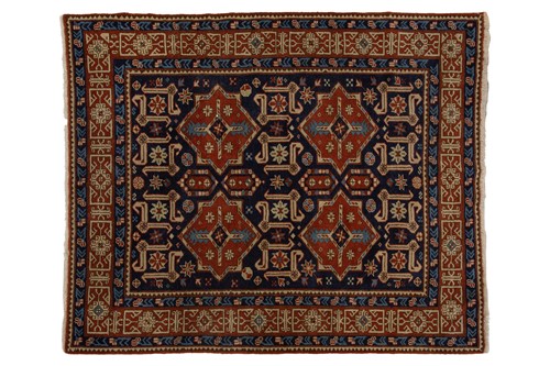 Lot 154 - An Azerbaijan rug of indigo blue ground, with...