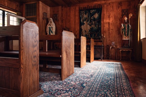 Lot 30 - Three stained oak church pews, 20th century,...