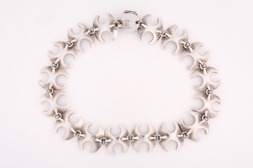 Lot 270 - Georg Jensen - a necklace with sixteen concave...