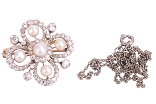 Lot 25 - A diamond and pearl quatrefoil brooch. The...