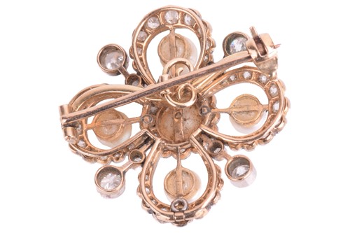 Lot 25 - A diamond and pearl quatrefoil brooch. The...