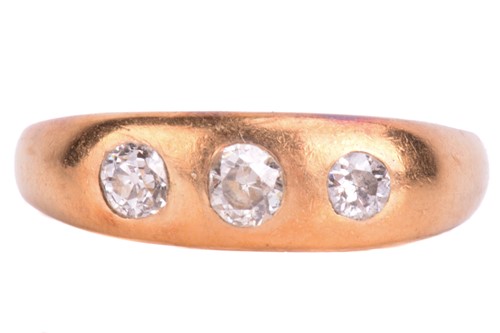 Lot 271 - An 18ct gold diamond set three stone ring. Old-...