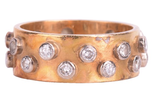 Lot 156 - A diamond eternity band in 18ct yellow gold...