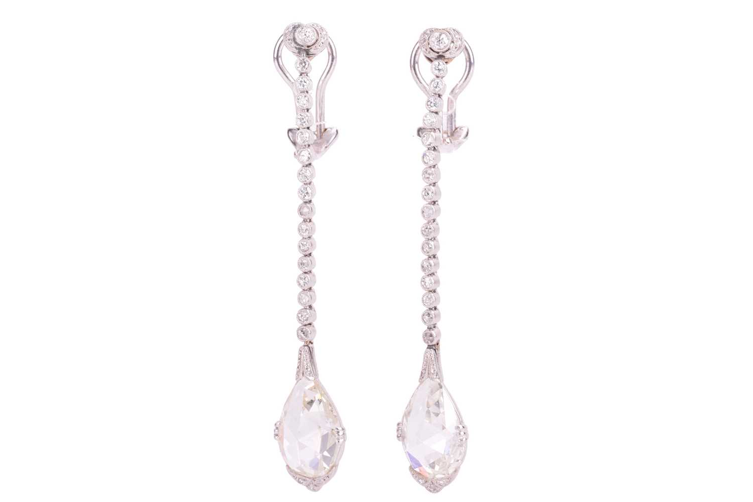 Lot 96 - A pair of diamond drop earrings, suspended...