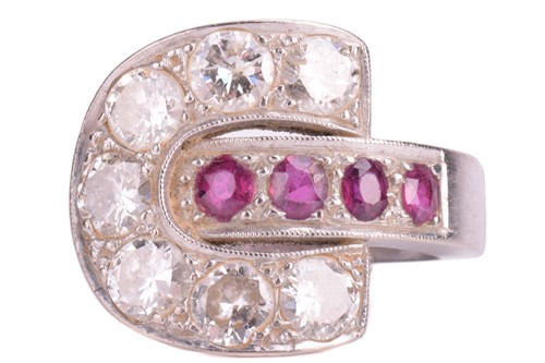 Lot 147 - A ruby and diamond buckle-style ring in a...