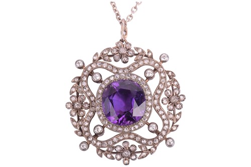 Lot 218 - An Edwardian amethyst and diamond pendant,...