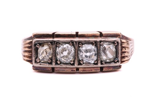 Lot 156 - An old cut diamond four stone ring, set with a...