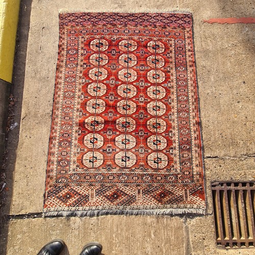 Lot 48 - A red ground antique Tekke Turkoman rug, 160...
