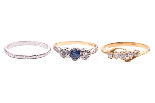 Lot 177 - Three rings; including a sapphire and round...