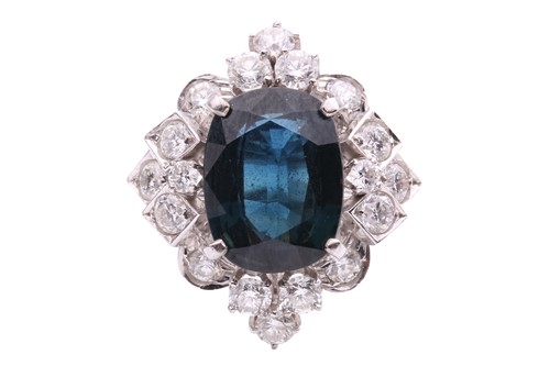 Lot 150 - A sapphire and diamond cluster ring, set with...