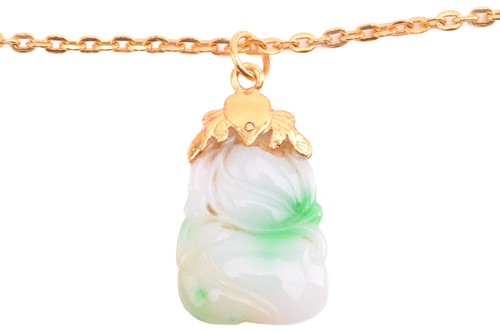 Lot 130 - A Chinese carved jade pendant on chain, the...