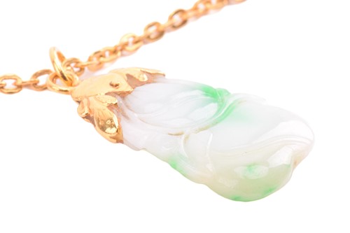 Lot 130 - A Chinese carved jade pendant on chain, the...