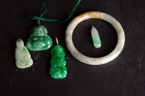 Lot 129 - A Chinese jade bangle and other four carved...