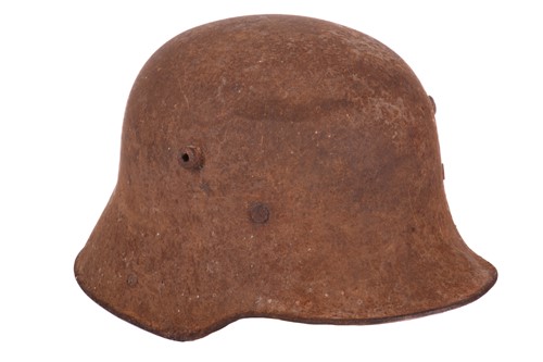 Lot 356 - A German WWI M16 Stahlhelme pressed tin helmet,...